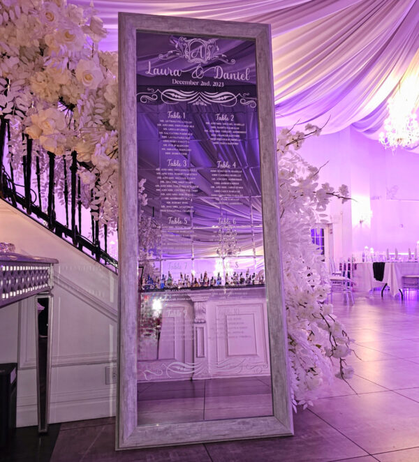 A Parisian mirror with custom white vinyl names and designs to serve as your guest chart as seen here for Laura's engagement event in Ariana's South done by PMT Party Services Group