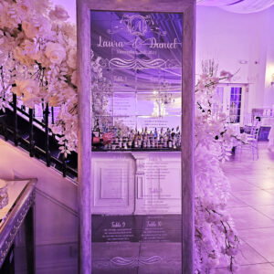 A Parisian mirror with custom white vinyl names and designs to serve as your guest chart as seen here for Laura's engagement event in Ariana's South done by PMT Party Services Group